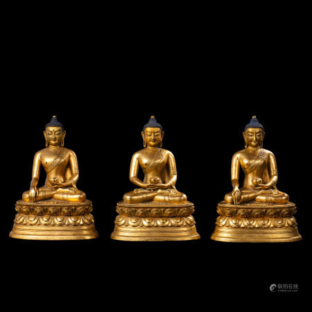 A Group of Chinese Qing Dynasty Gilt-Bronze Seated Figures of the Three Buddhas