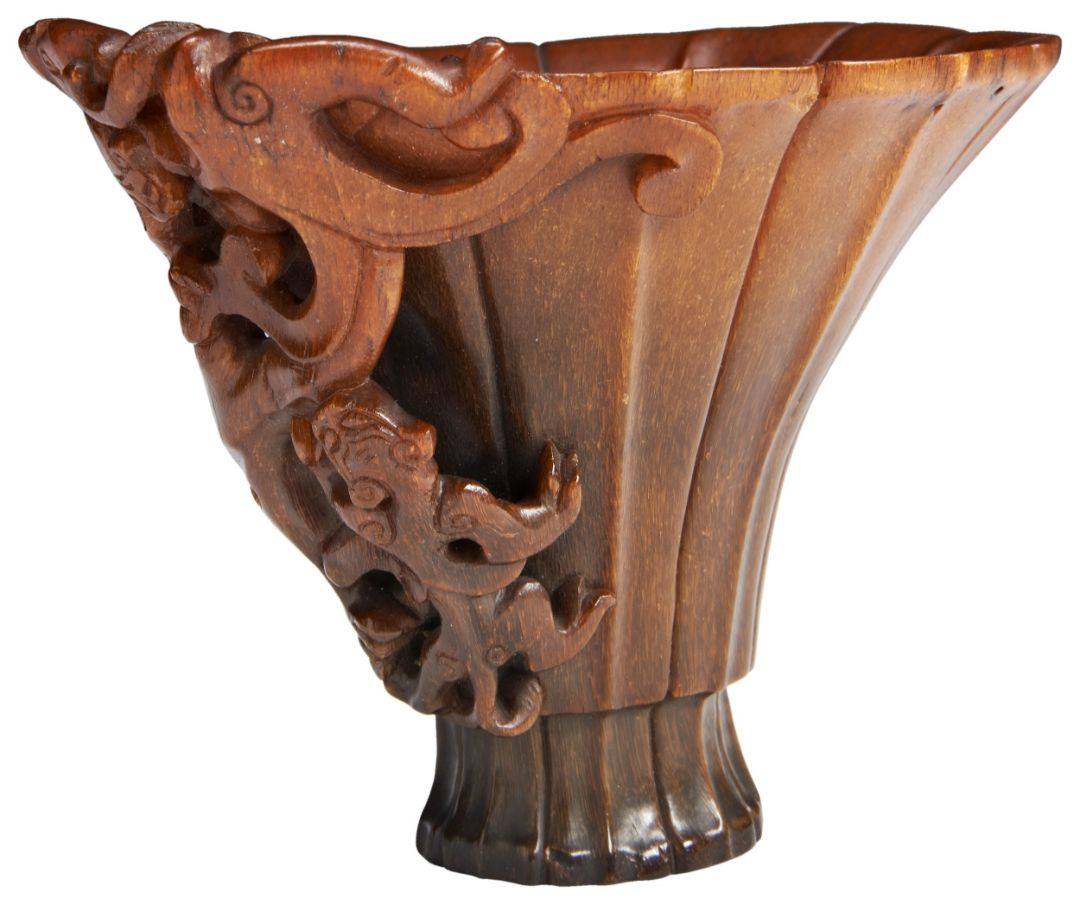 A FINE RHINOCEROS HORN LIBATION CUP  KANGXI PERIOD, (1662-1722) 螭龙犀角杯 康熙 十七世纪  in the form of a
