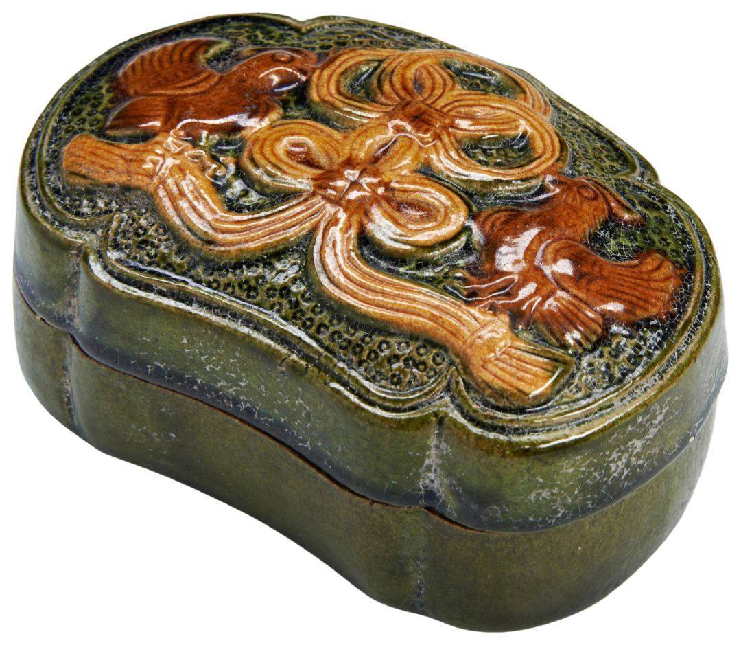 AN AMBER AND BLUE-GLAZED COSMETIC BOX WITH FLORAL AND SCROLLING CLOUD MOTIFS TANG DYNASTY (618–