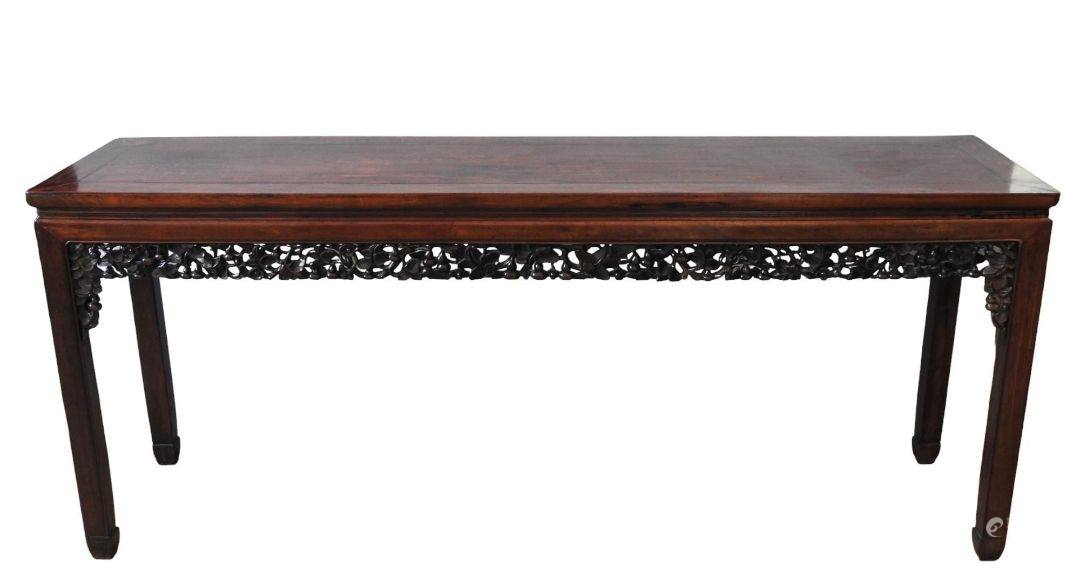 A CARVED HARDWOOD ALTAR TABLE QING DYNASTY, 19TH CENTURY 清 十九世纪红木条案 the rectangular top above an