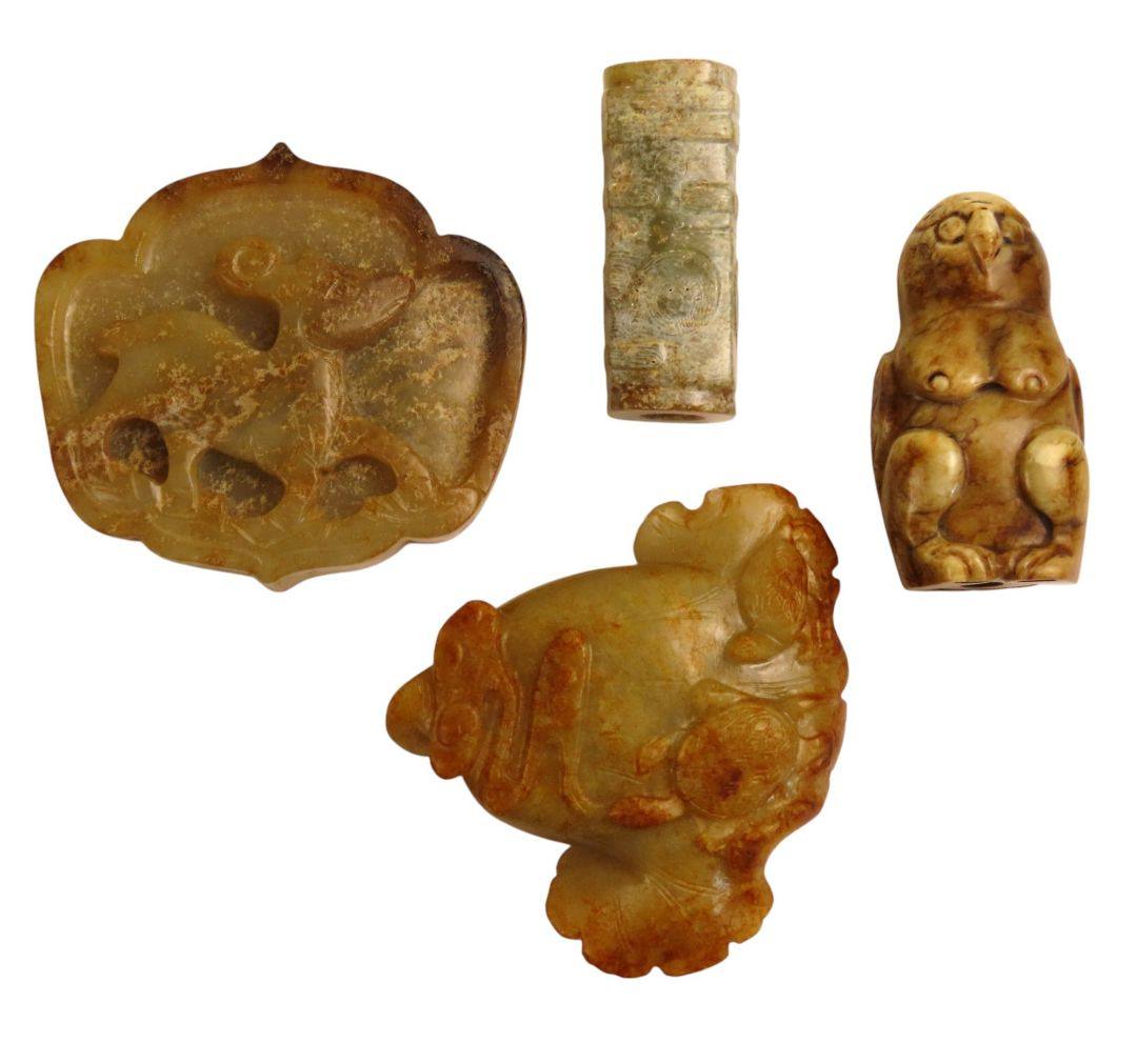 A GROUP OF FOUR CARVED RUSSET JADE PANDENTS, 20TH CENTURY