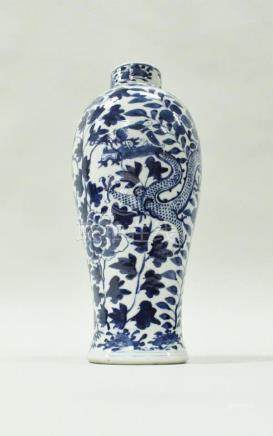  A Chinese blue and white baluster shaped vase decorated with two four toed dragons amongst