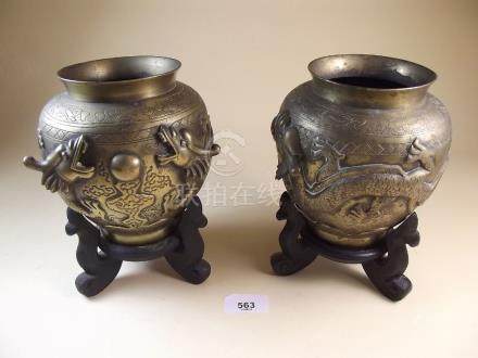  A pair of Chinese brass vases decorated dragons, Chinese marks to base, 16cm tall