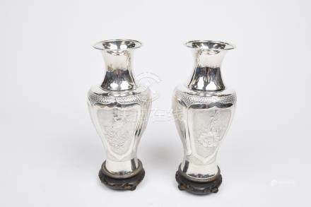  A pair of Chinese white metal vases, c.1900 Each of baluster form extending to a splayed upper