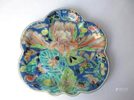  A 19th century Chinese cabinet plate of unusual form, brightly decorated with butterflies and