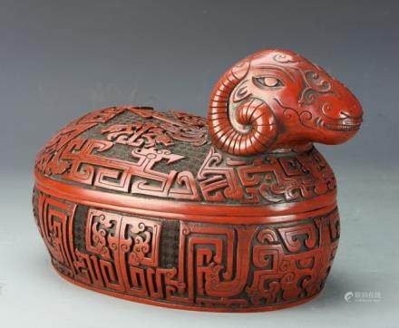 Cinnabar box with cover, carved as a ram with auspicious symbols throughout. 