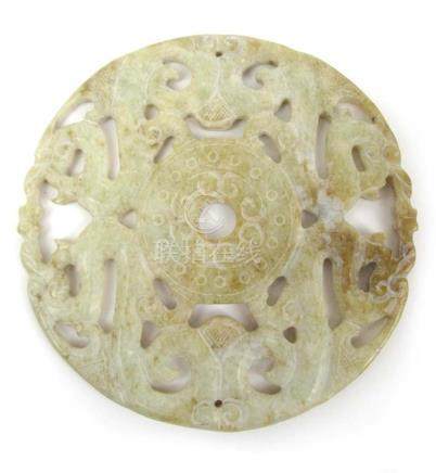  A 20th century Chinese pierced and carved pale celadon jade medallion, dia. 11.5 cm