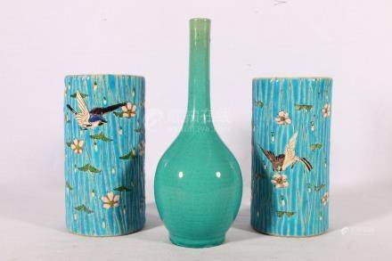  Pair of Japanese vases, the blue glazed column vases textured with birds and flower head decoration,