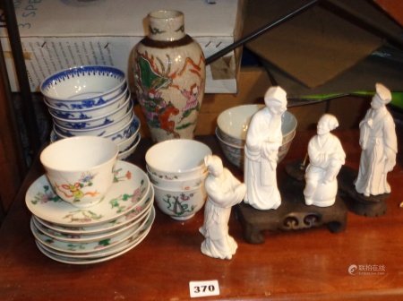 Chinese porcelain bowls and saucers, crackleware vase, blanc-de-chine figures on stands etc