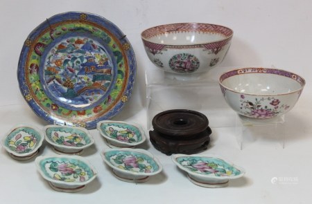 Two 18th century Chinese porcelain bowls, one with floral roundels, fish scale and lattice