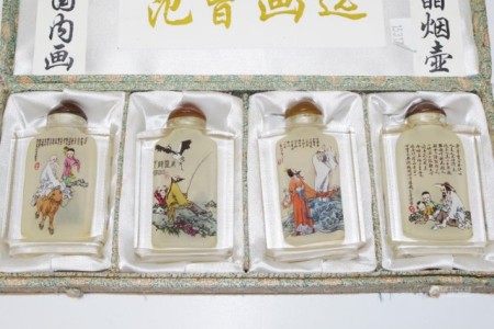 Boxed set four Chinese crystal snuff bottles