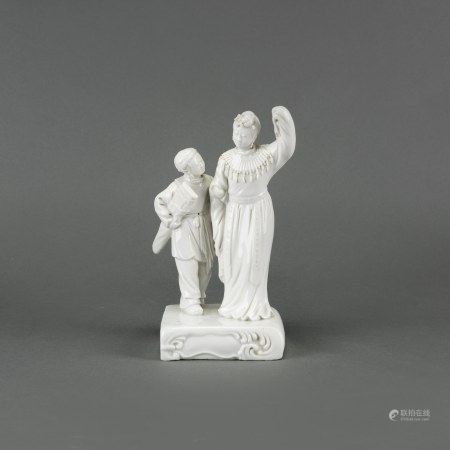 A WHITE GLAZED FIGURE GROUP 