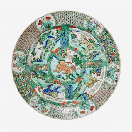 A Chinese famille verte-decorated "Mythical Beasts" porcelain charger, Kangxi period