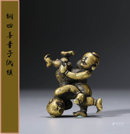 清早期  铜四喜童子纸镇