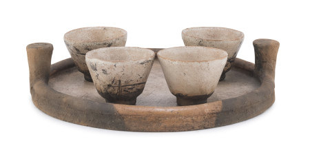 A CHINESE TERRACOTTA TRAY WITH FOUR CUPS 20TH CENTURY.