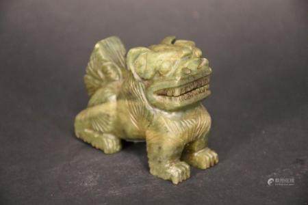 A Chinese stone carved figure of the dog. H 7cm, W 8cm