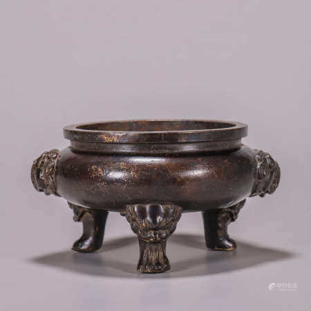A three-legged copper censer with beast head-shaped ears