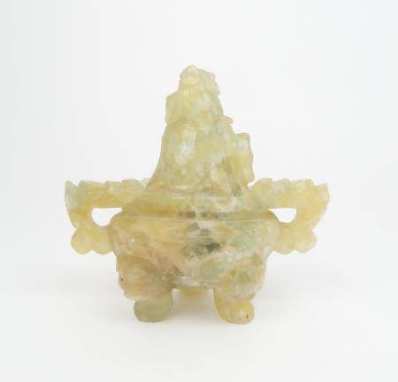 A CHINESE GREEN QUARTZ INCENSE BURNER carved with grotesque handles, kylin finial and on mask and