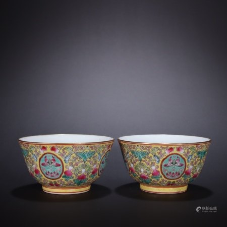 A Chinese A pair of yellow ground vermicelli tea bowls